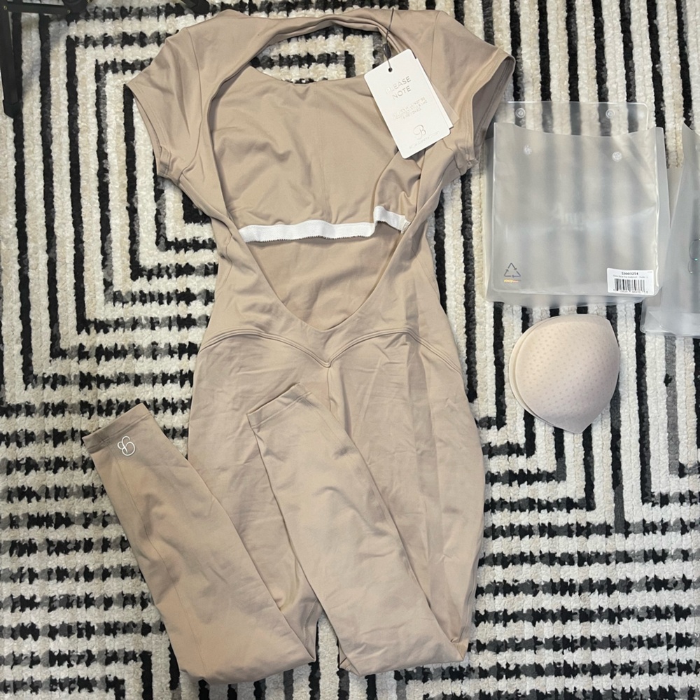 Bombshell Sportswear open back tee bodysuit in nude size LARGE NWT